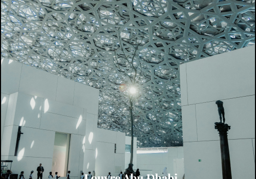Exterior view of Louvre Abu Dhabi with iconic dome and Saadiyat Island skyline – NSB Tourism UAE